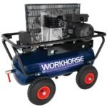 Heavy-duty air compressor with wheels and motor.