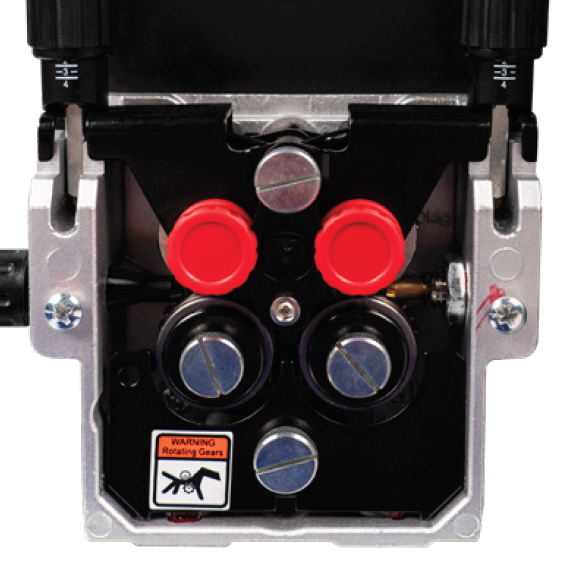 Close-up of gear mechanism with safety warning.