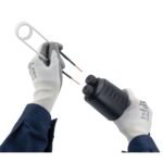 Hands holding wires and electrical component