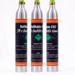 Three refillable CO2 cylinders for beverages.
