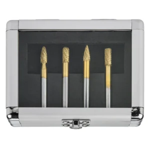Four rotary burrs in a silver case.