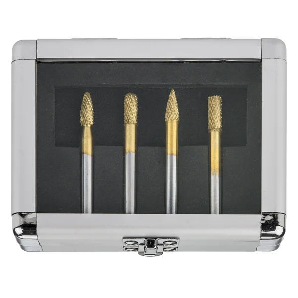 Four rotary burrs in a silver case.