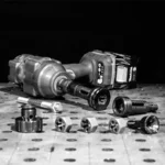 Power tools and hardware parts on a workbench