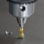Close-up of a drill bit extracting material.