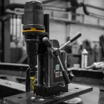 Close-up of a magnetic drill press machine.