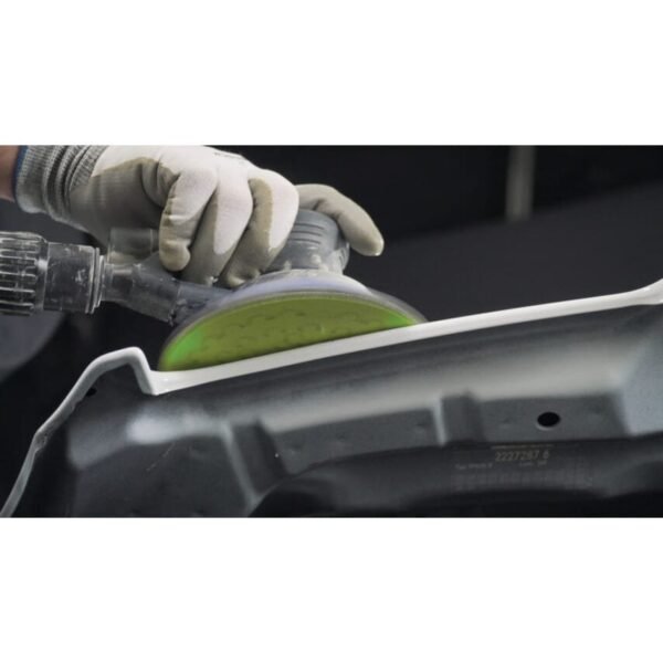 Person using a tool to sand a metal surface.
