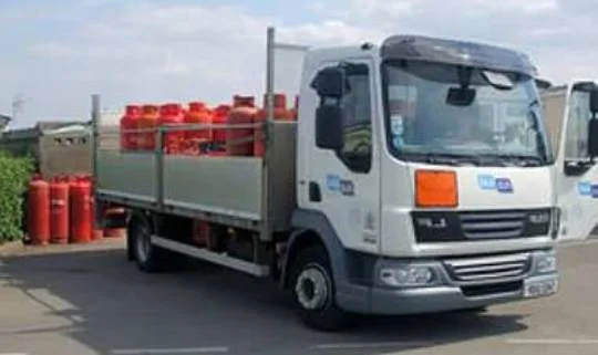 Delivery truck loaded with gas cylinders.