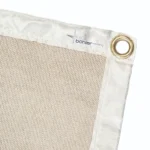 Close-up of a beige fabric with grommets