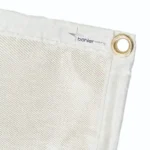 Close-up of a white fabric with grommet.