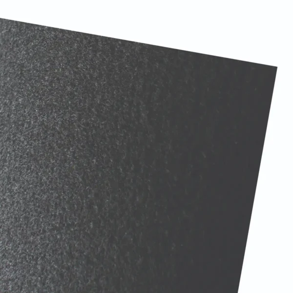 Textured dark paper surface with subtle sheen.