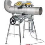 Industrial pipe cutting machine with a powered roller.