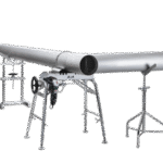 Metal pipe setup with support stands and equipment.