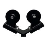 Close-up of a dual-wheel pulley mechanism.