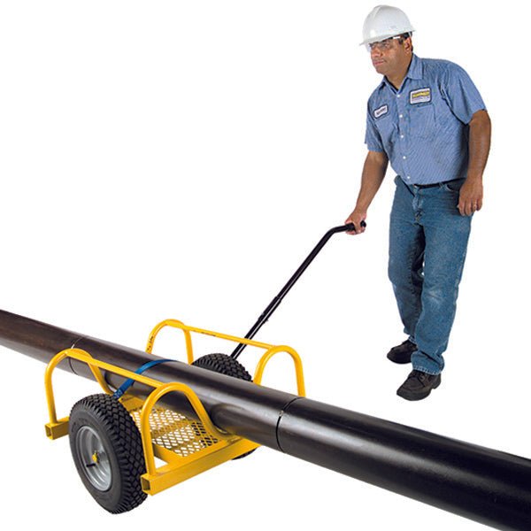 Man transporting a large pipe with a cart.