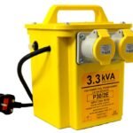 Yellow power tool transformer with multiple sockets.