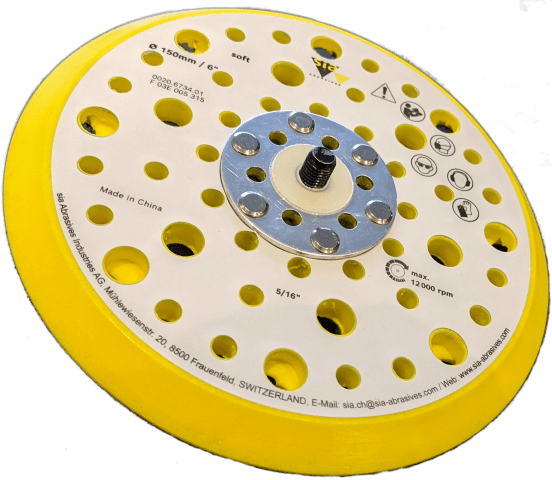 Yellow sanding disc with multiple holes for dust extraction.