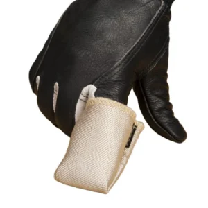 Close-up of a black leather glove with beige cuff.