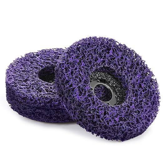 Two purple cleaning pads stacked together