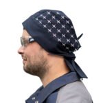 Man wearing airplane-patterned bandana and safety glasses